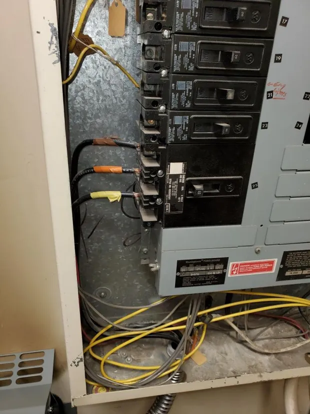 Breaker panel with newly landed conductors